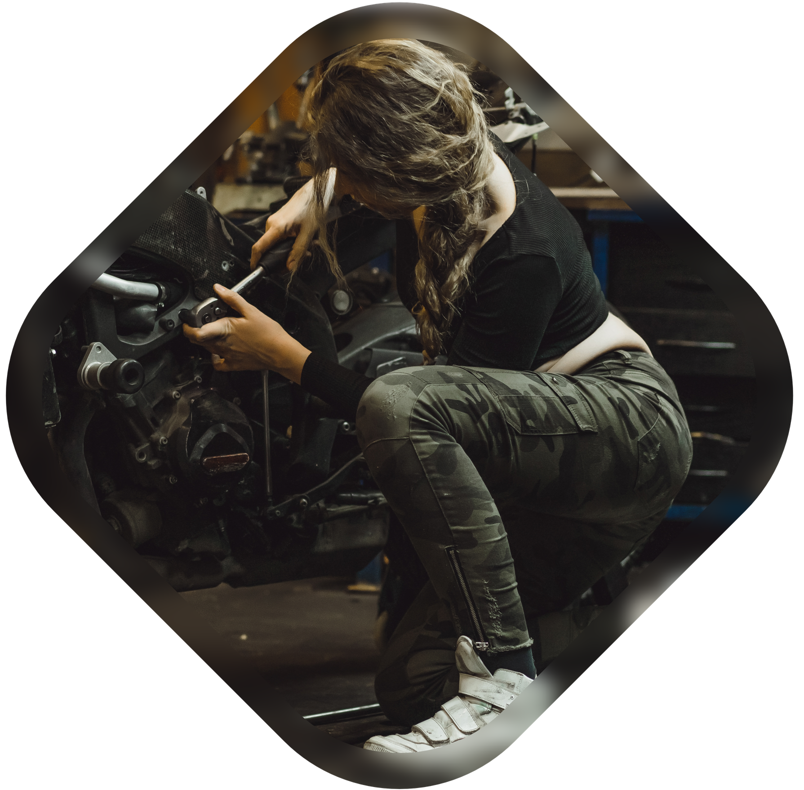 beautiful-girl-with-long-hair-garage-repairing-motorcycle Beautiful girl in garage repairing motorcycle